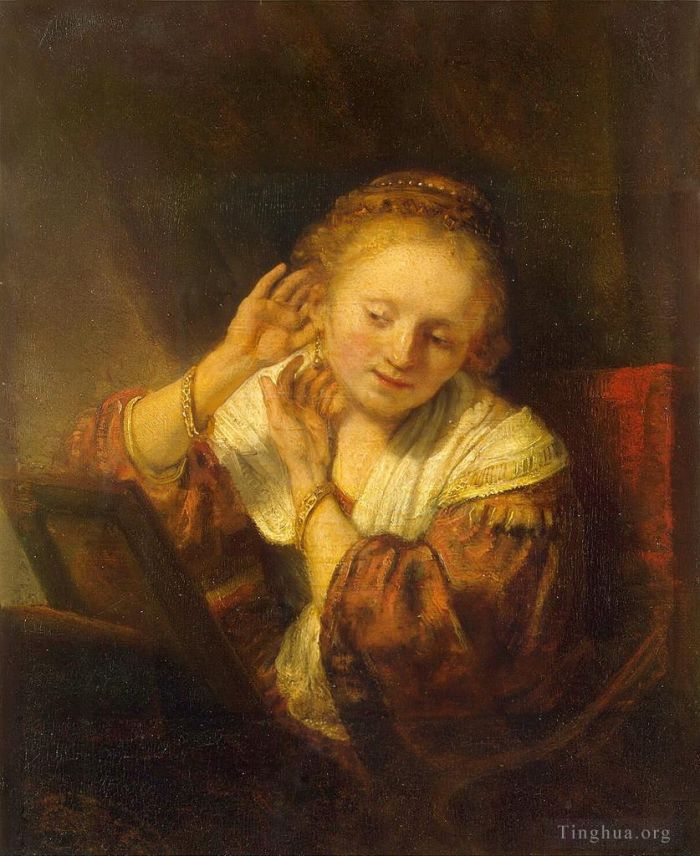 Rembrandt Ölgemälde - Junge Frau probiert Ohrringe aus